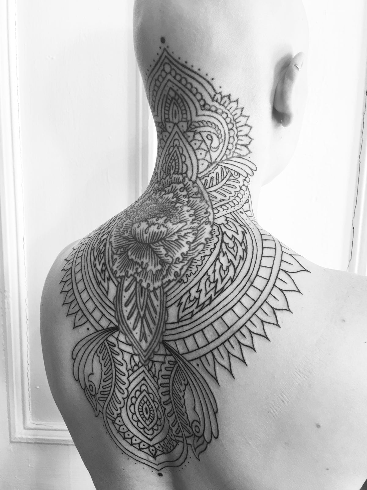 KB, "Sacred Poppy", Ink in Skin, 9" x 17". 2017