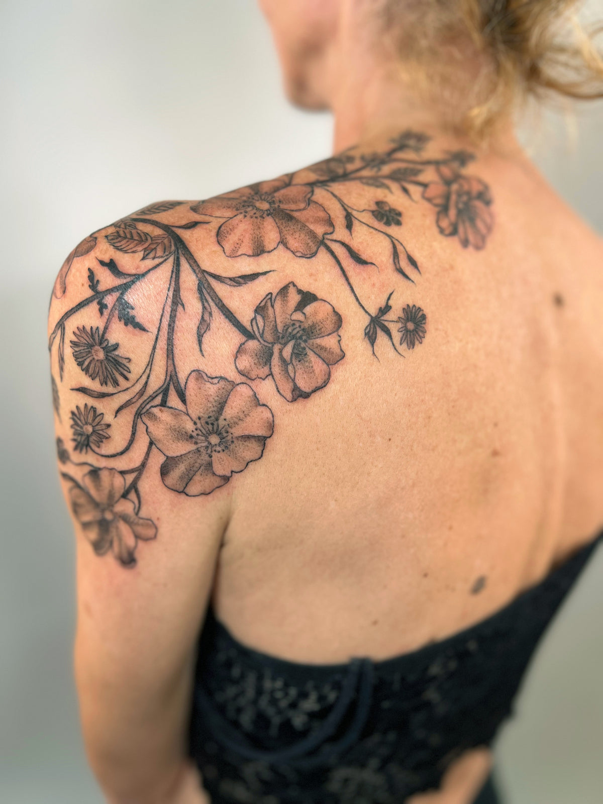 KB, "Wild Roses", Ink in skin, 12" x 13". 2024
