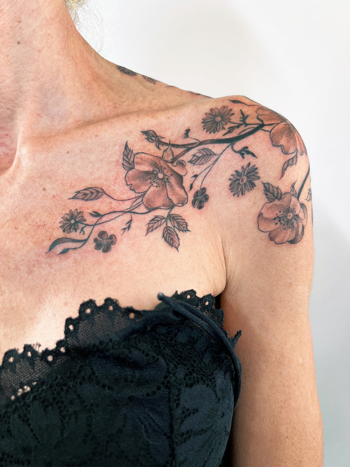 KB, "Wild Roses", Ink in skin, 12" x 13". 2024
