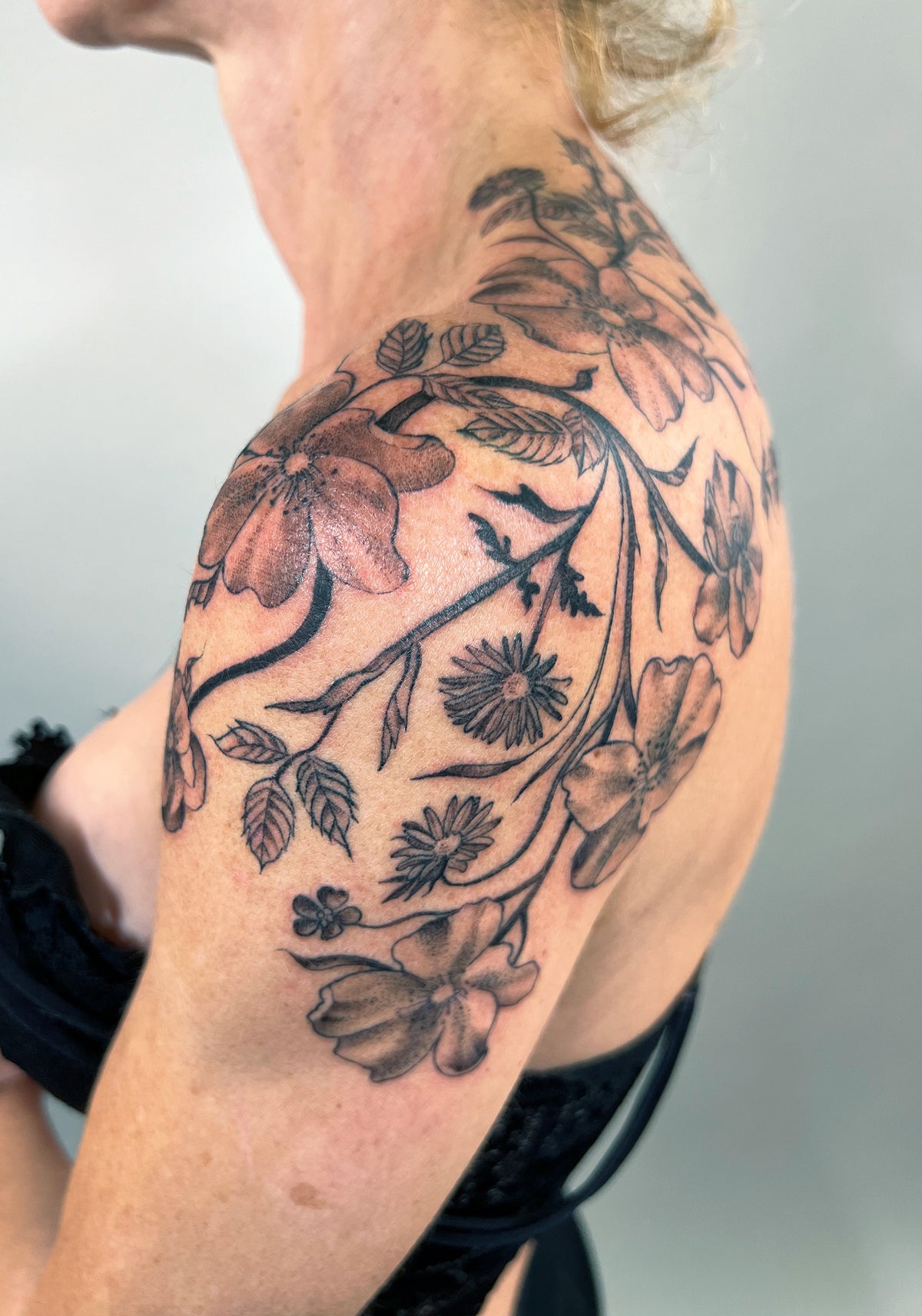 KB, "Wild Roses", Ink in skin, 12" x 13". 2024